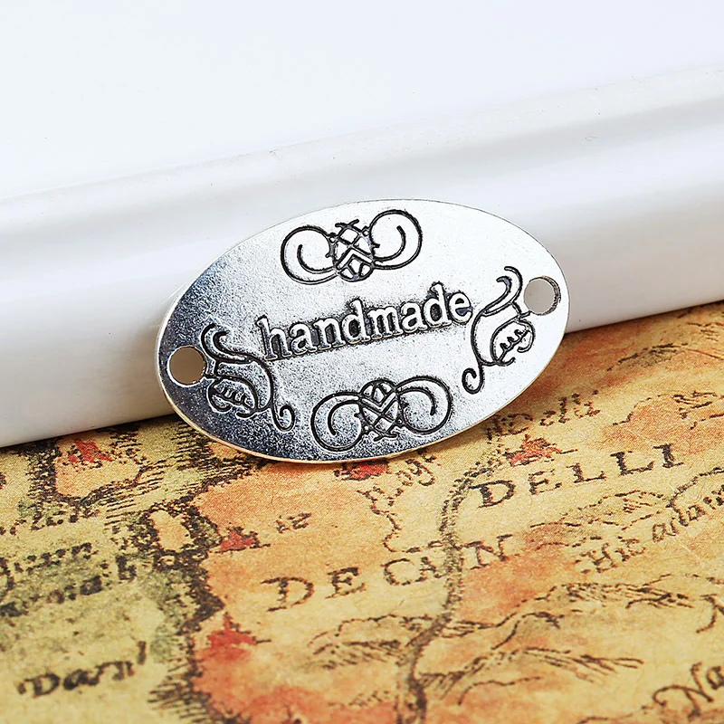 ETICHETTA METALLO "HANDMADE" - 4 PZ ARGENTO